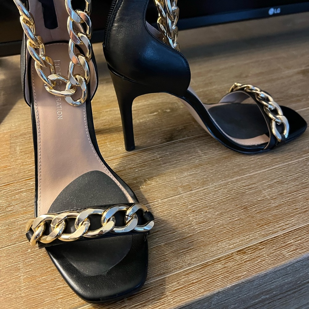 Never worn BCBG black heels with gold chain